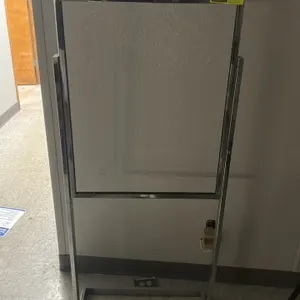Metal sign stand. Features a chrome-finished steel frame designed to hold a 22"W x 28"H sign. Top-loading design for easy sign insertion. Mounted on a