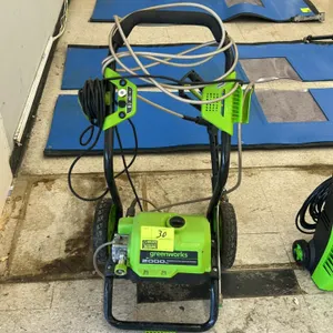 Greenworks 2,000 PSI electric portable pressure washer. Features on-board hose wrap, spray gun wand, high-pressure hose, and power cord. Mounted on a 