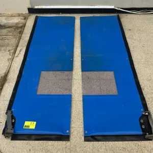 Pair of poly swing doors. Features flexible blue polymer construction, clear view windows, and black edge seals. Bottom mounting hinges included.