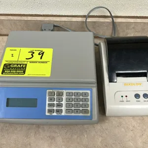 Digital counting scale and Bixolon receipt printer. Scale features a digital display, numeric keypad, and denomination function buttons. Bixolon recei