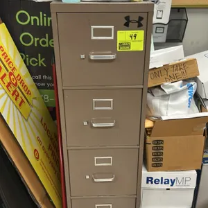 Metal 4-drawer vertical filing cabinet. Features a tan finish, four drawers with pull handles, and integrated label holders. 26" x 15". Note: Sticker 