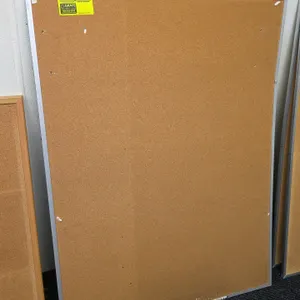 Metal framed corkboard. Features a natural cork bulletin surface with a silver-tone aluminum frame. Designed for wall mounting. 36"x48".