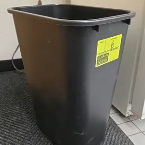 Rubbermaid plastic waste basket. Features a rectangular design and a black finish. 20"H. Contents not included.