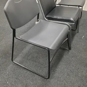 Assorted metal frame chairs. Includes (2) plastic chairs featuring black molded plastic seats and backs with handle cutouts on black steel sled bases,