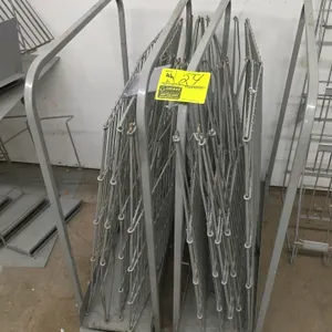 Metal-framed merchandiser display stands with assorted wire merchandise display baskets. Features two metal storage and display frames designed to hol