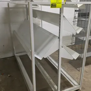 Portable double-sided merchandiser display rack. Features adjustable angled metal shelves on both sides. 51" x 25". Mounted on a wheeled base with cas