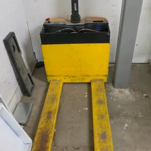 2007 Vestil EPT-2547 electric pallet jack. Features a 3,000 lb. capacity. Equipped with integrated batteries and a detached plastic top cover. S/N: S4