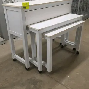 Portable nesting table set. Includes three nesting tables featuring white tops with natural wood-look edge banding and matching white frames. Designed