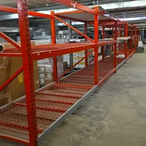 8' section of Madix pallet racking. Features 3.5" crossbars and wire decking. Orange metal frames and beams with wire grid decks. Dimensions: 48" x 81