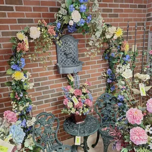Ornate Metal Garden Arbor with Floral Decor