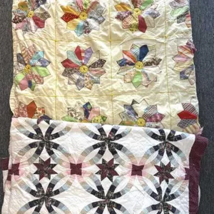 (2) Quilts 
- one on top has multiple large