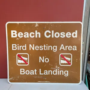 Large metal Beach Closed Bird Nesting Area No Boat Landing Sign