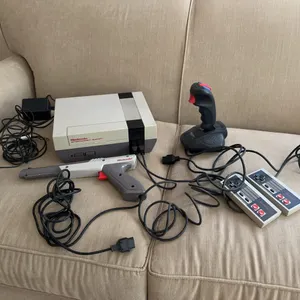 Nintendo game console-NES with 2 controllers, 1 grey Zapper + more