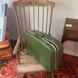 Vintage Hitchcock style rocking chair andvintage suitcase