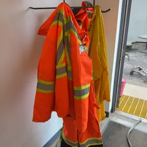 Lot of (2) Coat Racks with Asst. Overalls, Jackets, etc.