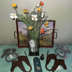 Decorative Assortment: Horse Head Hooks, Door Knockers, Vase with Flowers, and Framed Tray