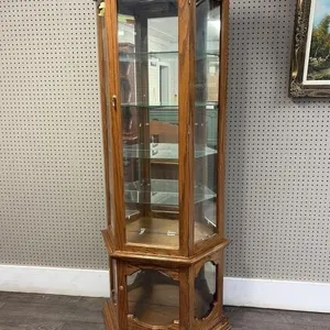 oak-finished curio cabinet