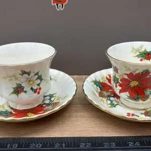 2 Royal Albert Poinsettia Christmas Tea Cups.