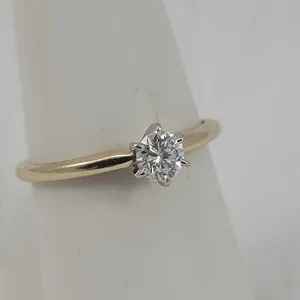4.5 mm Diamond in a 6 prong White Gold setting mounted on a 14K Yellow Gold, size 8 band. 2.2g OB
