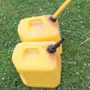 Two 5 gal. Plastic Diesel Cans