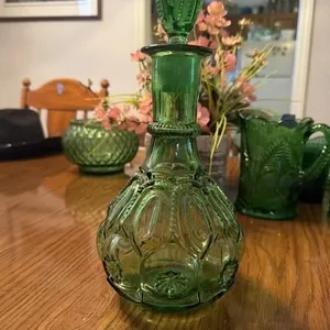 This vintage emerald green glass decanter is a