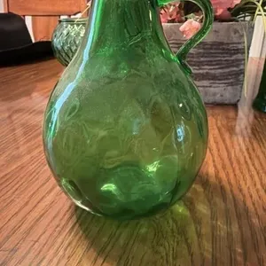 This is a vintage avocado green mouth-blown g