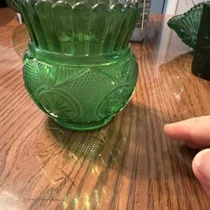 This vintage A.L.R. Co. emerald green glass vase