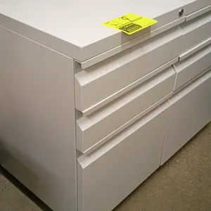 Metal 3-drawer pedestal filing cabinet. Features a white finish, two upper box drawers, and one lower file drawer. Designed for under-desk or standalo