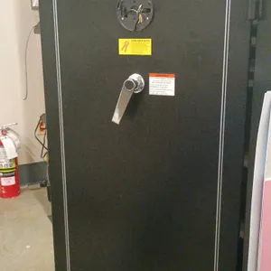 Union Safe Company safe. Features carpeted interior with adjustable shelving and (5) plastic cash drawers. 29"x55"x20". Note: Electronic keypad lock i