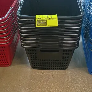 Plastic shopping basket. Features durable black poly construction and dual folding metal wire carrying handles with plastic grips. Red and blue basket