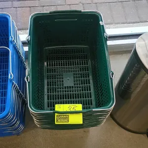 Poly green shopping basket. Features durable plastic mesh construction, dual folding metal handles with plastic comfort grips, and a stackable design.