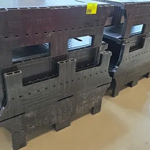 Magliner CooLift polyethylene delivery racks. Features durable plastic construction with nesting design, bottom grid pattern, and integrated carrying 