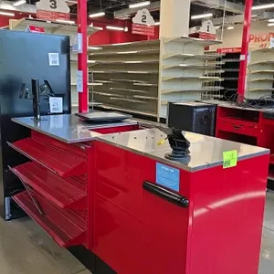 2024 Royston red metal check-out lane stand. Features a stainless steel top, front-facing wire merchandising shelves, a checkout number 4 sign pole, a