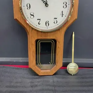 FORESTVILLE BATTERY OPERATED WALL CLOCK W/ A PENDULUM