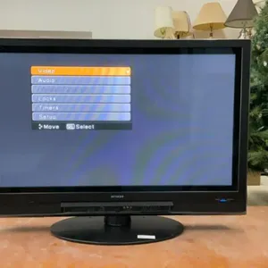 HITACHI 42” FLAT SCREEN TV ON STAND - NO REMOTE