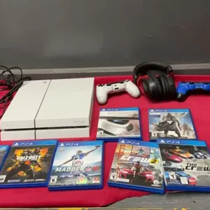 PS4 CONSOLE W/ (2) CONTROLLERS & HEADSET W/GAMES