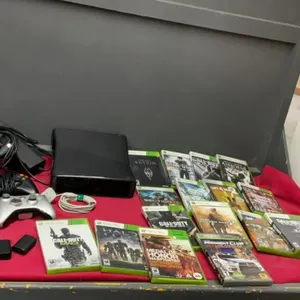 XBOX 360 CONSOLE W/ (4) CONTROLLERS, VARIETY OF GAMES & (2) EXTRA BATTERY PACKS