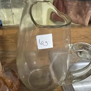 Glass pitcher with utensils