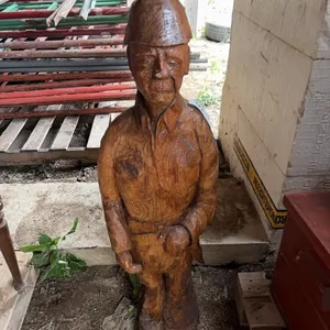 "Strong Man” wood statue