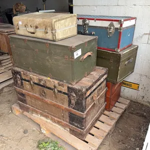 Assorted antique trunks w/ quilts