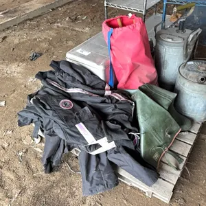 2) Vintage Arctic Cat snow suits w/ croquettes set, rubber boots & fuel cans
