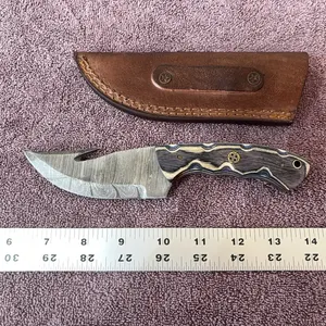 Damascus steel knife with gut hook