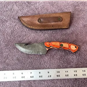Damascus steel knife with gut hook