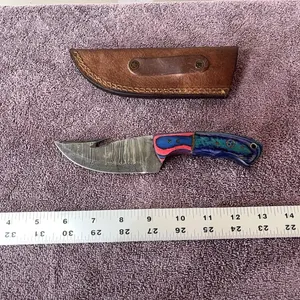 Damascus steel knife with gut hook