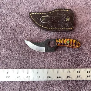 Damascus steel knife with finger hole