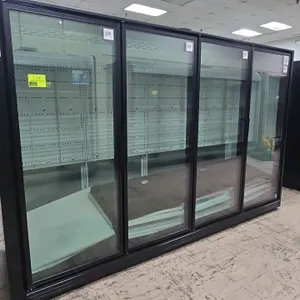 2026 True TRM4M-YY-BLK-WHT-1BLKLLLL-4 4-door medium-temp glass door display case. Features black frame, glass doors, and interior shelving. Refrigeran