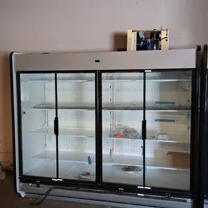 2025 Hussmann IDD5SU8 4-door medium-temp glass door display case lineup. Features adjustable shelving and top-mounted compressor. S/N: MY25L082073. El