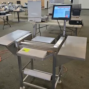 Hobart HWS-4 hand wrapping station. Features Bizerba touchscreen digital scale and integrated label printer. Stainless steel construction with dual si