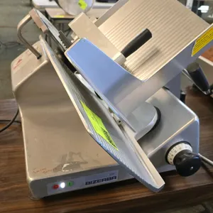 Bizerba GSPH manual gravity feed deli slicer. Features 13" blade, adjustable slice thickness, and anodized aluminum construction. Electrical: 120V, 60