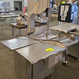 Biro 3334 commercial meat saw. Features stainless steel construction, sliding meat carriage, and adjustable thickness gauge. Equipped with push-button